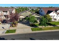 Aerial view of a two-story house with a green facade at 6988 S Riverwood Way, Aurora, CO 80016