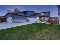 Modern two-story home with two-car garage and landscaped yard at 16487 W 12Th Dr, Golden, CO 80401