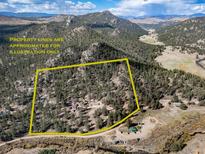 Secluded property surrounded by trees and mountains at 18101 S Buffalo Creek Rd, Conifer, CO 80433