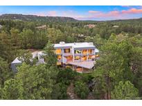 Luxury home nestled in a wooded area with mountain views at 7 Elk Pointe Ln, Castle Rock, CO 80108