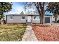 Ranch style home with landscaped yard and attached garage at 3092 S Kearney St, Denver, CO 80222