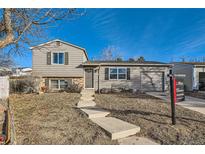 Attractive ranch-style home with a well-maintained lawn and landscaped yard at 17899 E Princeton Pl, Aurora, CO 80013