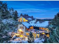 Luxury mountain home with expansive decks and stunning city views at 5237 Bear Mountain Dr, Evergreen, CO 80439