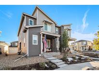 Two-story house with gray siding and a front porch at 5316 Spalding Pl, Frederick, CO 80504