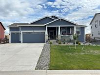 Stunning two-story home with a spacious front yard and attached two-car garage at 981 W Hopkins Dr, Elizabeth, CO 80107