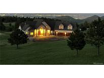 Luxury home on a sprawling lot with mountain views at 5236 Bear Mountain Dr, Evergreen, CO 80439