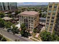 Aerial view of a luxury condo building with mountain views and courtyard at 25 N Downing St # 2-304, Denver, CO 80218