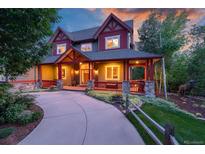 Stunning two-story home with a large wrap-around porch at 1300 W Caley Ave, Littleton, CO 80120