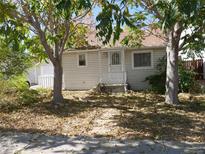 Adorable bungalow home with mature trees and a well-maintained yard at 765 S Krameria St, Denver, CO 80224