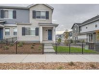Two-story townhouse with gray and white brick exterior at 27472 E 1St Ave, Aurora, CO 80018