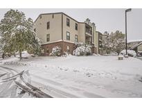 Snow covered building exterior, side view at 459 Wright St # 202, Lakewood, CO 80228