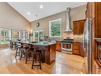 Gourmet kitchen with island, stainless steel appliances, and hardwood floors at 0507 Cr 674, Breckenridge, CO 80424