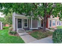 Townhouse with welcoming front entrance and landscaping at 1001 Milo Cir # A, Lafayette, CO 80026