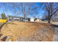 Ranch style home with mature trees and a spacious yard at 11531 E Dakota Ave, Aurora, CO 80012