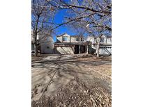Two-story house with attached garage and landscaping at 4361 Argonne St, Denver, CO 80249