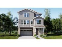 Two-story home with gray siding, stone accents, and a two-car garage at 6726 E 149Th Dr, Thornton, CO 80602
