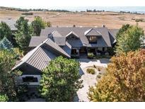 Aerial view of house and surrounding landscape at 5764 Amber Ridge Dr, Castle Pines, CO 80108