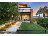 Modern two-story home with stone accents and landscaping at 3950 Osage St, Denver, CO 80211