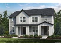 Two-story home featuring gray siding, white trim, and a front porch at 630 N Bently St, Watkins, CO 80137