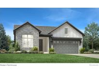 Modern farmhouse style home with gray garage door and stone accents at 3015 Newfound Lake Rd, Berthoud, CO 80513