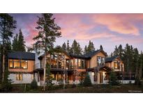Luxury mountain home with expansive windows and a large deck at 72 Dyer Trl, Breckenridge, CO 80424