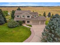 Two-story house with a large yard and driveway at 5861 E Valley Hi Dr, Parker, CO 80138