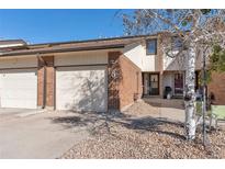 Brick front exterior of a townhome with attached garage at 125 S 22Nd Ave # 6, Brighton, CO 80601