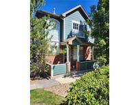 Exterior view of a two-story home with a brick and teal facade at 2855 Rock Creek Cir # 158, Superior, CO 80027