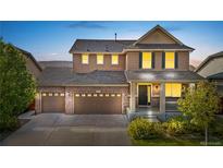 Stunning two-story home with a landscaped front yard and two-car garage at 463 N Jamestown Way, Aurora, CO 80018