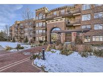 Brick building exterior with landscaping and a walkway at 2700 E Cherry Creek South Dr # 313, Denver, CO 80209