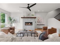 Modern living room with fireplace and hardwood floors at 3830 Stuart St, Denver, CO 80212