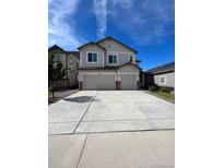 Two-story house with three-car garage and landscaping at 4773 S Wenatchee Cir, Aurora, CO 80015