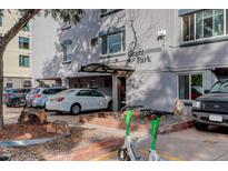 Exterior view of apartment building with parking and landscaping at 336 N Grant St # 206, Denver, CO 80203