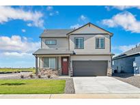 Two-story house with stone and siding exterior at 832 Crest St, Lochbuie, CO 80603