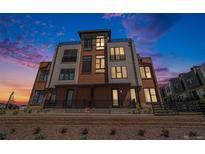 Modern three-story brick townhome with a metal balcony at 2680 Westview Way # 55, Superior, CO 80027
