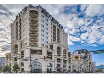 Elegant high-rise building with classic architecture and attractive landscaping at 925 N Lincoln St # 8E-S, Denver, CO 80203