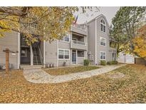 Exterior view of a building, showing walkways and autumn leaves at 5745 W Atlantic Pl # 206, Lakewood, CO 80227