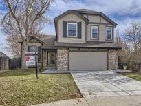 Two-story house with a large attached garage and landscaping at 11262 Winona Ct, Westminster, CO 80031