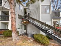 Exterior view of condo building with stairs and landscaping at 5550 W 80Th Pl # 20, Arvada, CO 80003