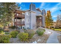 Gray two-story condo building with balconies and landscaping at 17662 E Loyola Dr # 2132L, Aurora, CO 80013