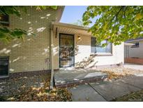 Ranch style home with mature trees and landscaping at 1646 S Winona Ct, Denver, CO 80219