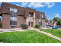 Attractive brick building with landscaping and ample parking at 7755 E Quincy Ave # 303A6, Denver, CO 80237