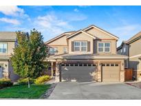 Two-story house with attached garage at 12653 Fisher Dr, Englewood, CO 80112