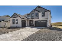 Two-story craftsman style home with gray and white exterior at 39779 Yorktown Ter, Elizabeth, CO 80107