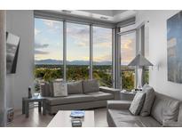 Modern living room with floor-to-ceiling windows and mountain views at 4200 W 17Th Ave # 618, Denver, CO 80204