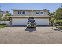Two-unit building with attached garages and landscaping at 2466 S Vaughn Way # B, Aurora, CO 80014