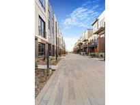 Modern townhomes with paved pathways and landscaping at 9071 Westminster Blvd, Westminster, CO 80031