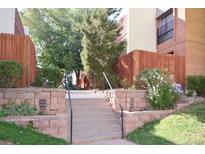 Front entrance with stairs and landscaping at 2815 S Locust St # F, Denver, CO 80222