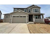 Two-story home with gray siding, large windows, and a two-car garage at 24520 E 36Th Ave, Aurora, CO 80019