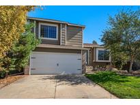 Two-story house exterior with a two-car garage and landscaping at 10532 Hyacinth St, Highlands Ranch, CO 80129